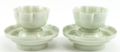 Lot 260 - PAIR OF QING QINGBAI PORCELAIN CUP AND STAND 宋 青白釉莲瓣盏及盏托
