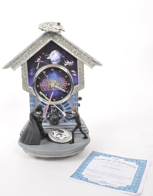 Lot 336 - THE BRADFORD EXCHANGE - A 2016 STAR WARS 'SITH VS. JEDI' WALL CLOCK